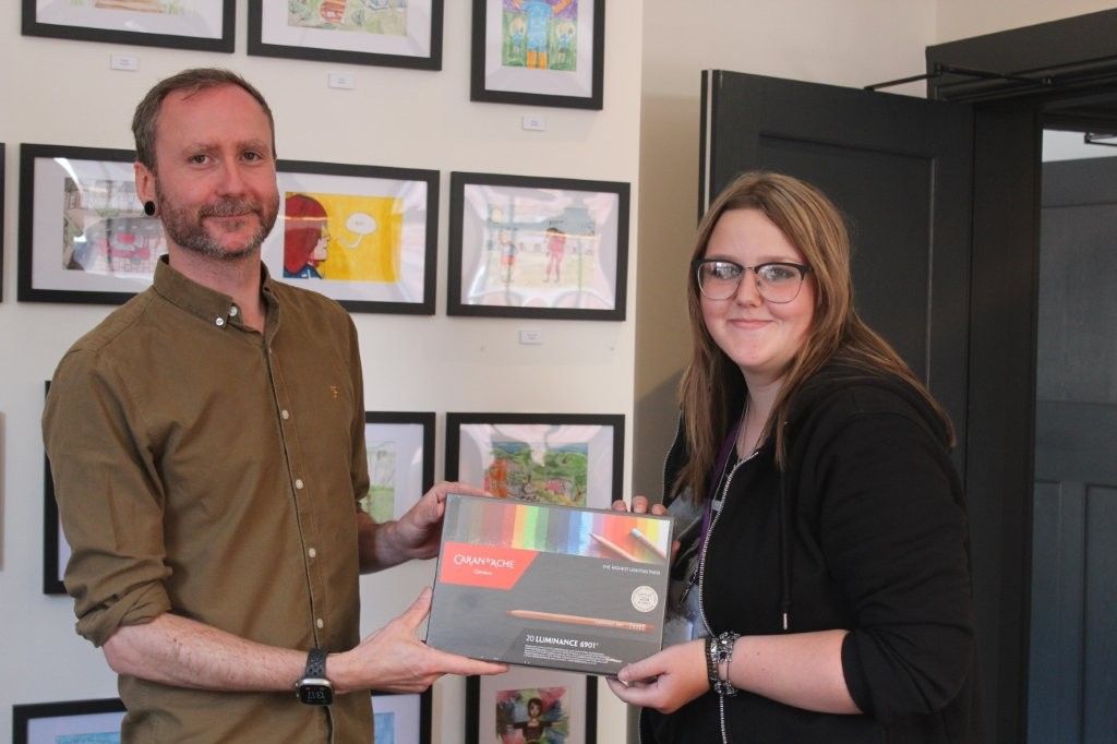 Colouring art set for the School Design Winner being handed over by Dan