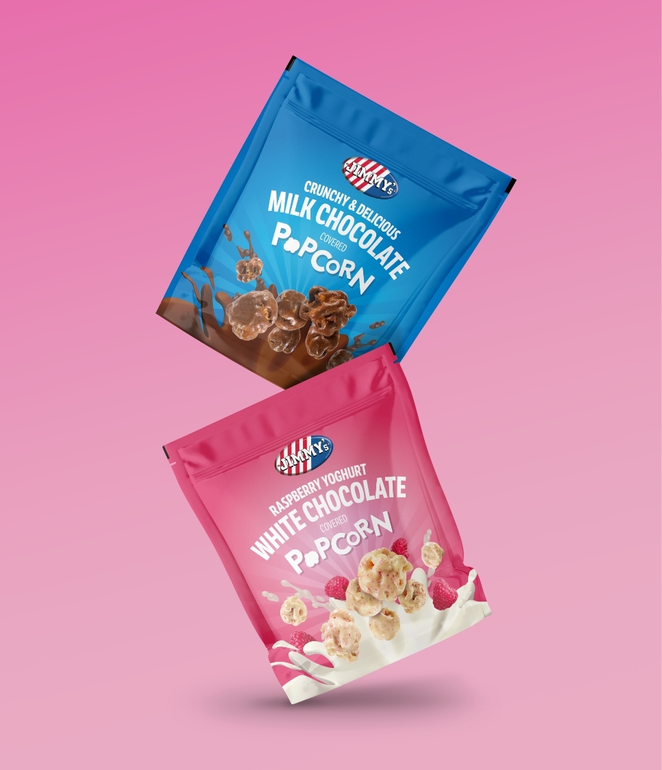 Jimmys Popcorn in Milk and White chocolate packaging shown on a pink background