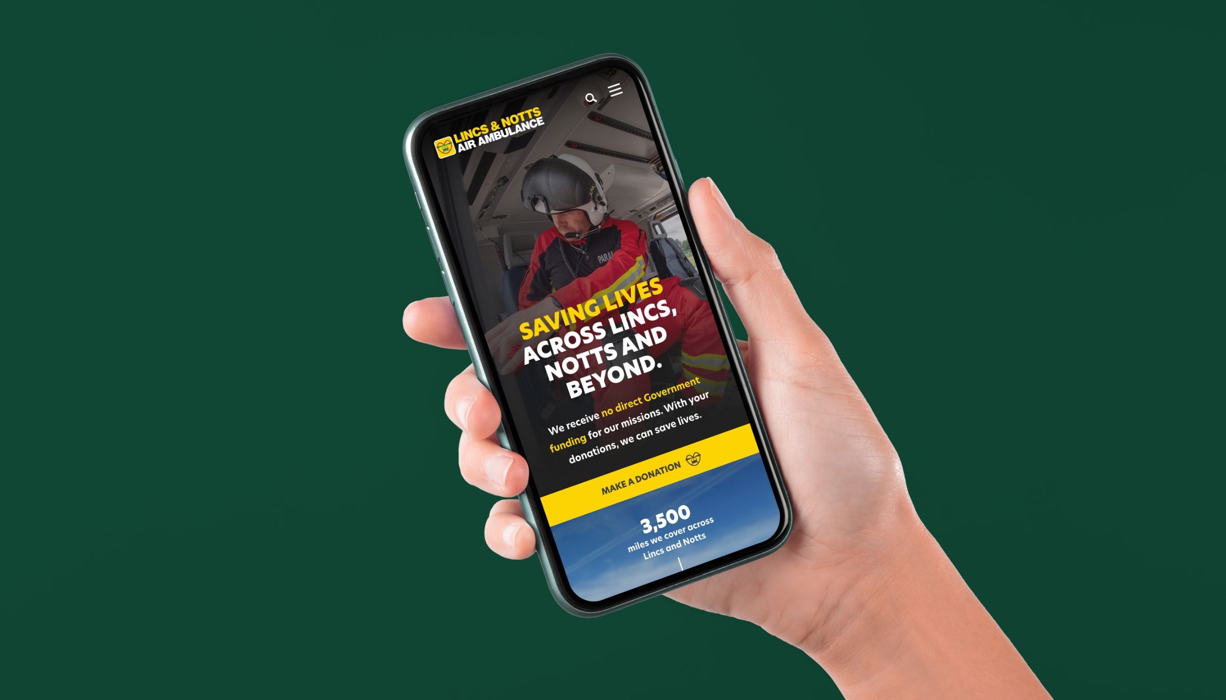 Mobile view of the Lincs & Notts Air Ambulance (LNAA) website shown on a smartphone held in a user’s hand.